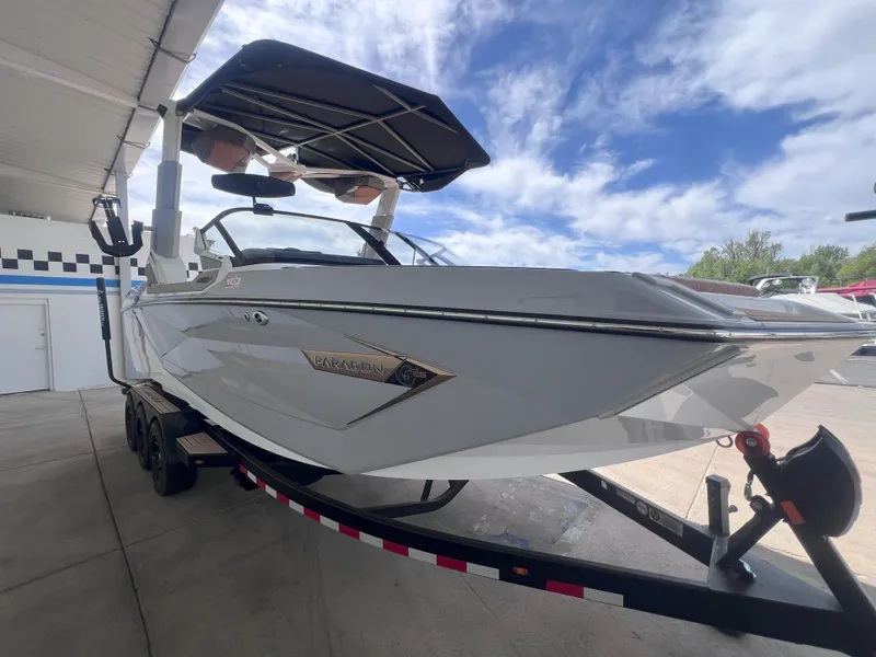 Slide: The Image of 2022 Nautique Super Air Nautique G25 Paragon boat on trailer under blue sky. - 4
