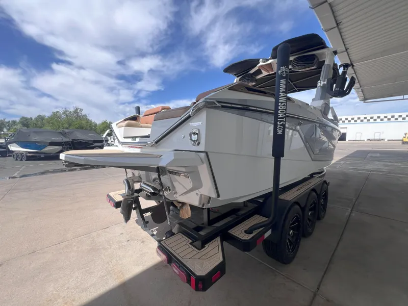 Slide: The Image of 2022 Nautique Super Air Nautique G25 Paragon boat on trailer, parked outdoors. - 6