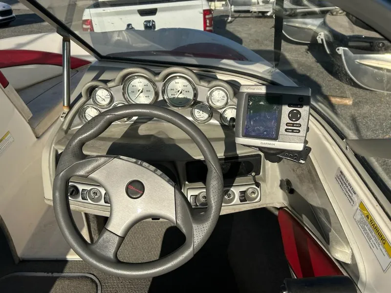 Slide: The Image of 2012 Bayliner 185 Bowrider dashboard with steering wheel and gauges. - 6