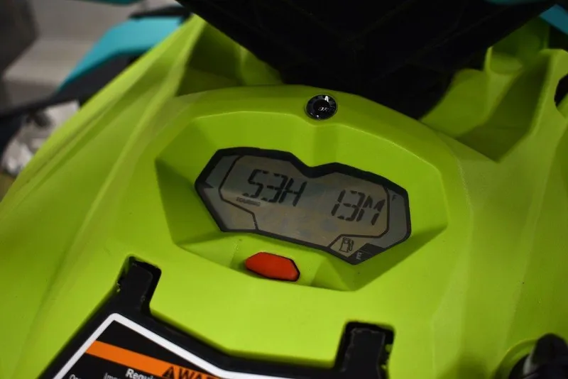 Slide: The Image of 2022 Sea-Doo Spark® 3-up dashboard display with digital screen and warning label. - 15