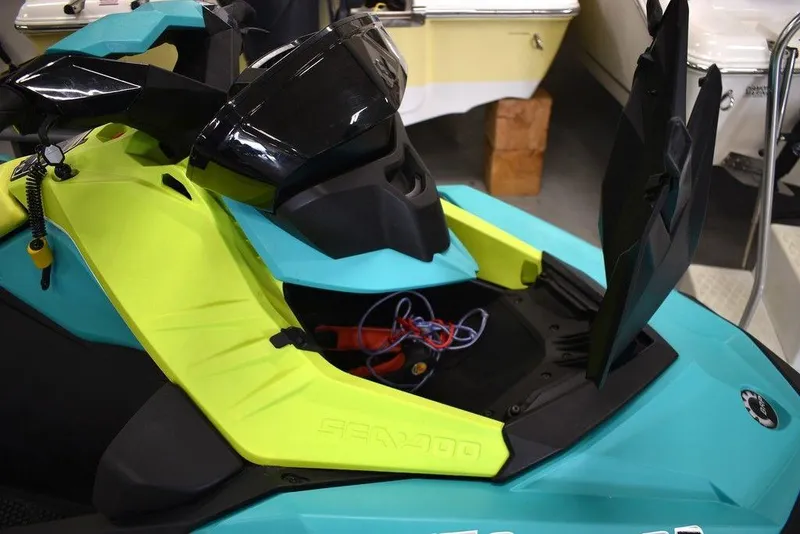 Slide: The Image of 2022 Sea-Doo Spark 3-up Rotax 900 ACE with Audio, vibrant colors, open storage compartment. - 16