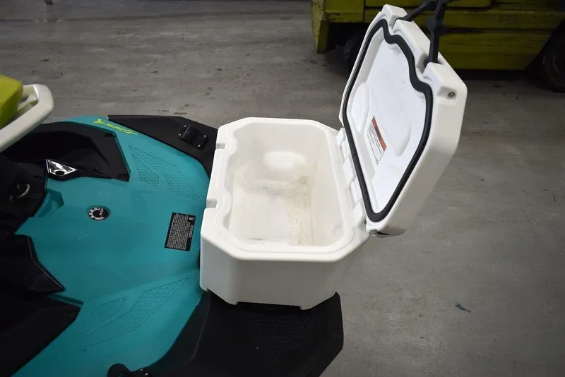 Slide: The Image of 2022 Sea-Doo Spark® 3-up storage compartment open, showcasing interior space. - 19