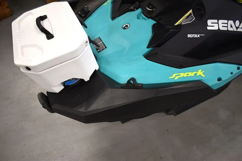 Slide: The Image of 2022 Sea-Doo Spark 3-up Rotax 900 ACE with storage box, teal and black design. - 21