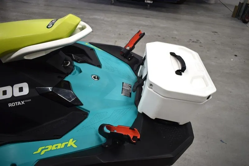 Slide: The Image of 2022 Sea-Doo Spark 3-up Rotax 900 ACE with storage box, teal and black design. - 23