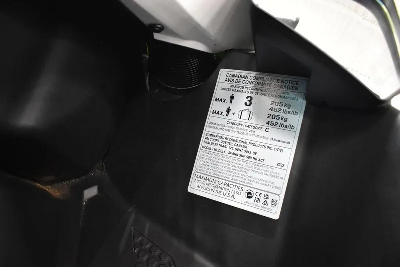 Slide: The Image of Label on 2022 Sea-Doo Spark® 3-up Rotax® 900 ACE™ showing weight capacity and specifications. - 26