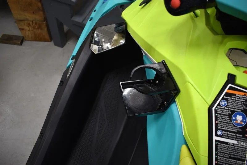 Slide: The Image of 2022 Sea-Doo Spark® 3-up Rotax® 900 ACE™ interior with cup holder and controls. - 33