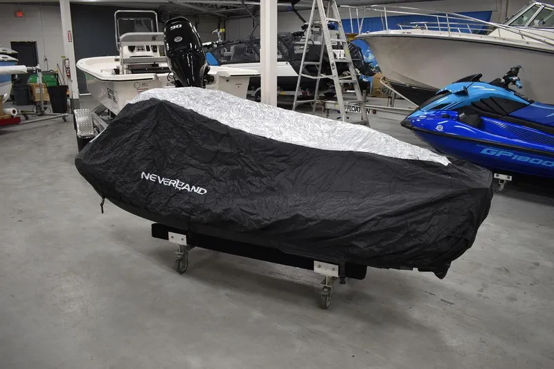 Slide: The Image of Covered 2022 Sea-Doo Spark 3-up Rotax 900 ACE in a garage setting. - 37