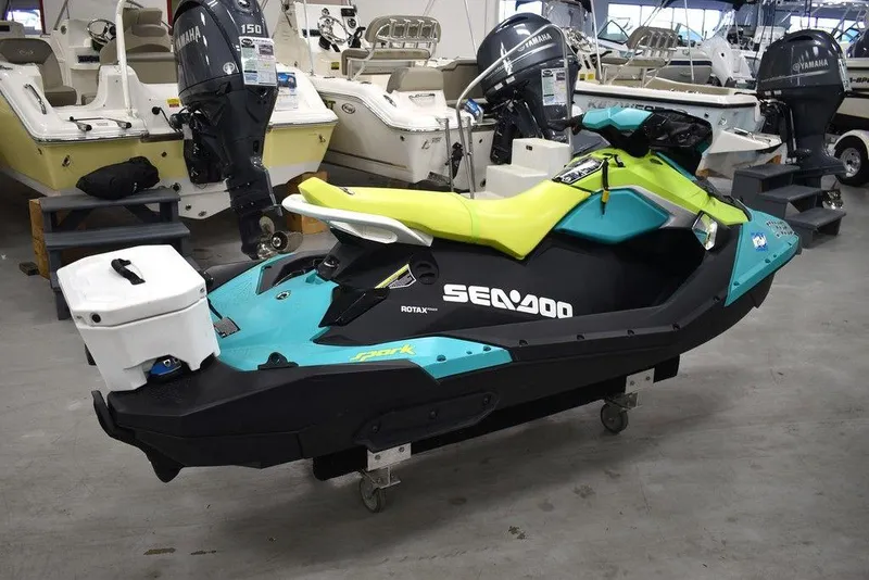 Slide: The Image of 2022 Sea-Doo Spark 3-up Rotax 900 ACE jet ski with audio, displayed indoors. - 4