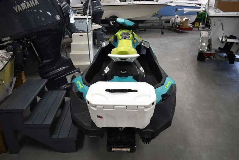 Slide: The Image of 2022 Sea-Doo Spark 3-up Rotax 900 ACE with Audio, in a showroom setting. - 7