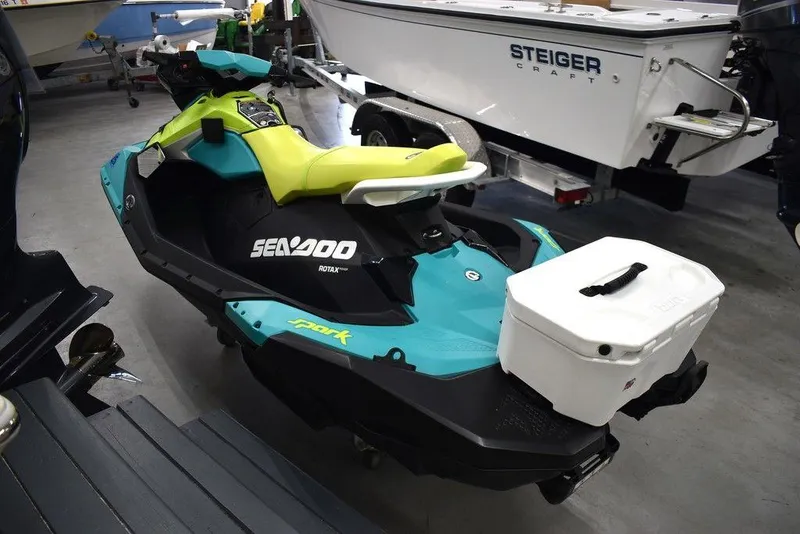Slide: The Image of 2022 Sea-Doo Spark 3-up Rotax 900 ACE with Audio, vibrant design in showroom. - 8