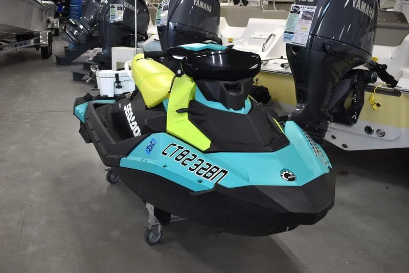Slide: The Image of 2022 Sea-Doo Spark 3-up Rotax 900 ACE jet ski with audio, displayed indoors. - 9