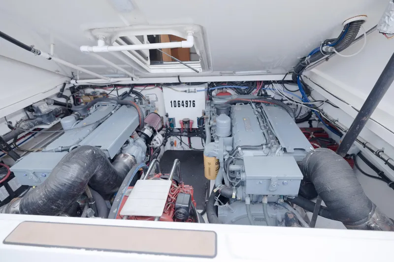 Slide: The Image of Engine room of a 1998 Tiara Yachts 3500 Open, showcasing dual engines and mechanical components. - 21