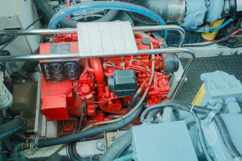 Slide: The Image of Engine compartment of a 1998 Tiara Yachts 3500 Open, featuring a red engine. - 22