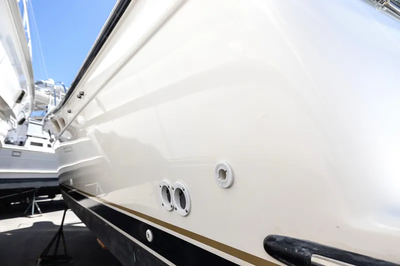 Slide: The Image of 1998 Tiara Yachts 3500 Open, white hull, docked, side view. - 25