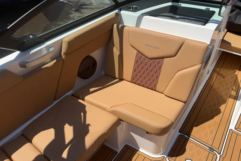 Slide: The Image of 2025 MasterCraft XT24 boat interior with tan leather seating and stylish design. - 29