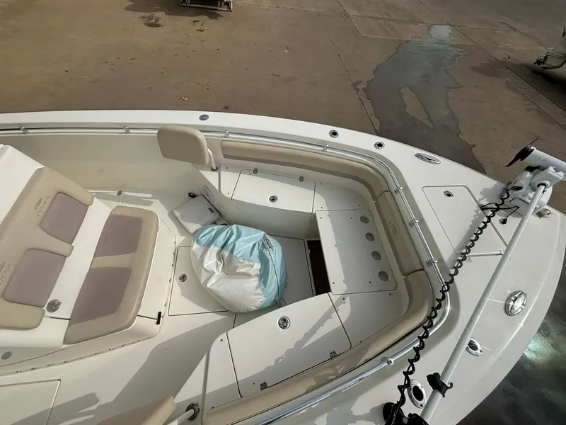 Slide: The Image of 2017 Cobia 296 Center Console boat interior with seating and storage compartments. - 15