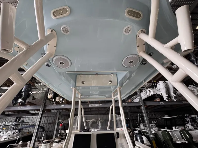 Slide: The Image of 2017 Cobia 296 Center Console boat in storage, viewed from below. - 41