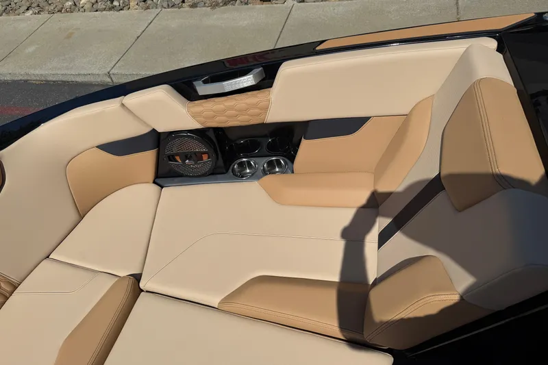 Slide: The Image of Luxurious interior of 2025 MasterCraft XT24 boat with beige and tan seating. - 36
