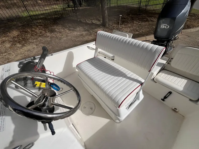 Slide: The Image of 2012 NauticStar 1810 boat interior with steering wheel and seating. - 24