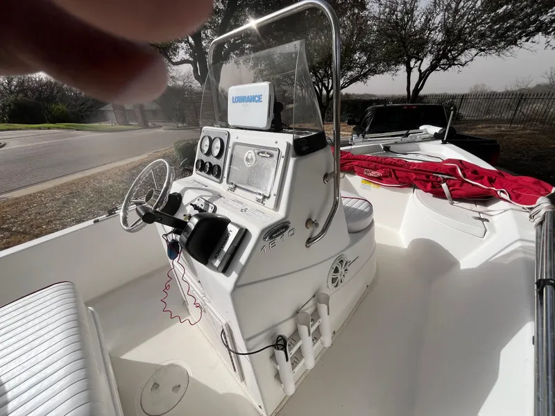 Slide: The Image of 2012 NauticStar 1810 boat interior with steering console and navigation equipment. - 28