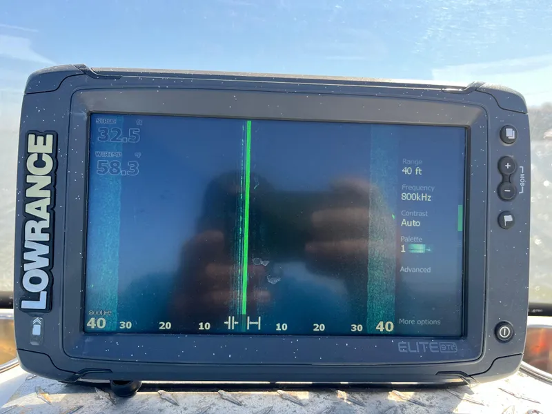 Slide: The Image of Lowrance Elite GPS fishfinder on a 2012 NauticStar 1810 boat displaying sonar data. - 48