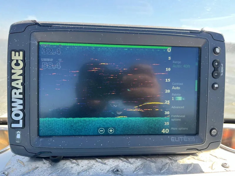 Slide: The Image of Lowrance Elite fish finder on a 2012 NauticStar 1810 boat, displaying sonar data. - 49