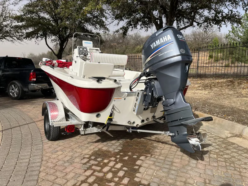 Slide: The Image of 2012 NauticStar 1810 boat with Yamaha outboard motor on a trailer. - 7