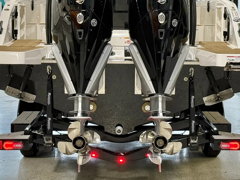 Slide: The Image of 2025 Navan S30 boat with dual outboard motors and propellers, rear view. - 11