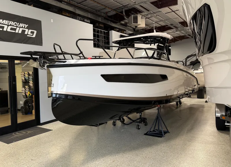 Slide: The Image of Navan S30 2025 boat displayed indoors, featuring sleek design and modern aesthetics. - 16