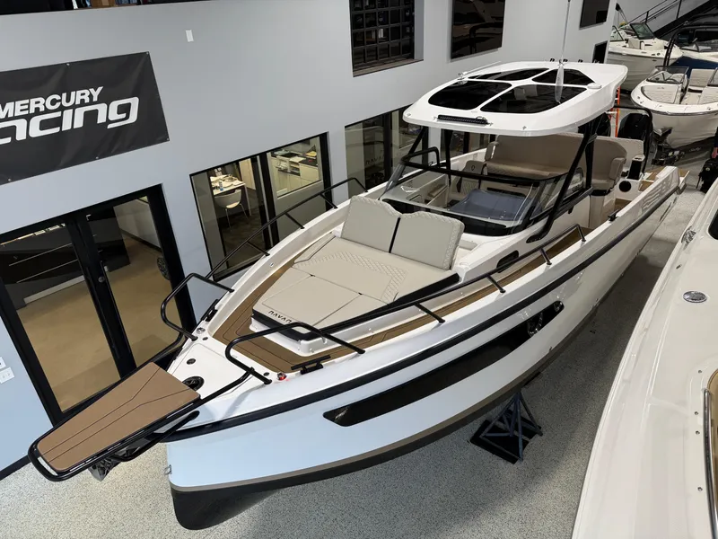 Slide: The Image of 2025 Navan S30 boat in showroom, featuring sleek design and modern amenities. - 19