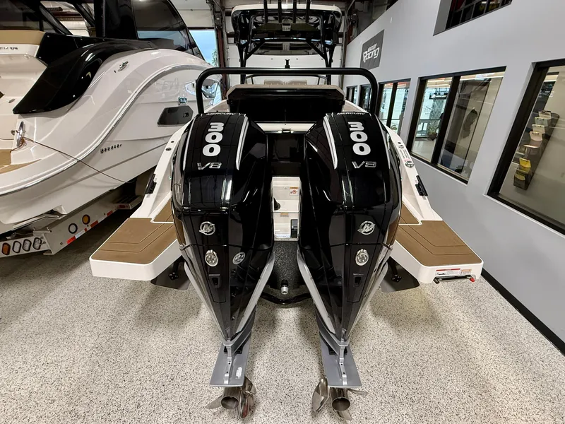 Slide: The Image of 2025 Navan S30 boat with twin 300 V8 engines in showroom. - 25