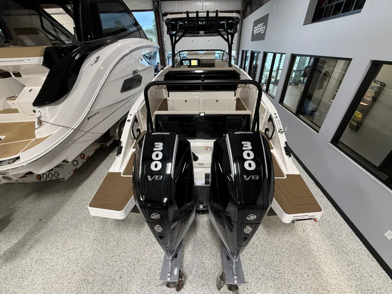 Slide: The Image of Navan S30 2025 boat with dual 300 V8 engines in showroom. - 26