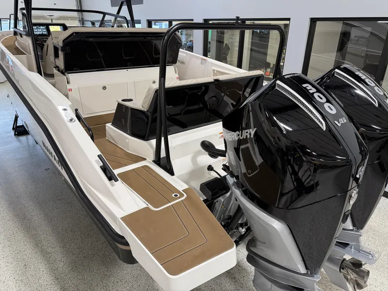 Slide: The Image of Navan S30 2025 boat with dual Mercury outboard engines, sleek design, and spacious interior. - 27