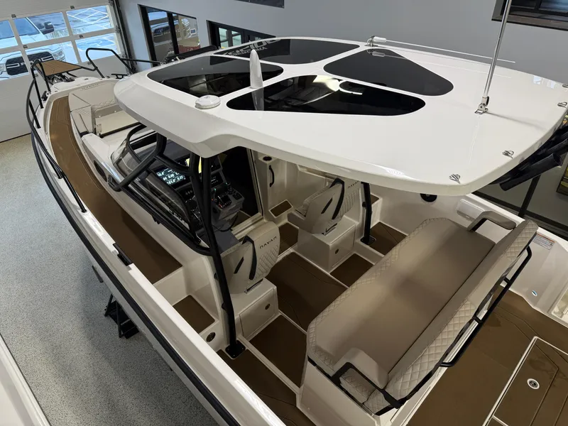 Slide: The Image of 2025 Navan S30 boat interior with modern seating and navigation console. - 31