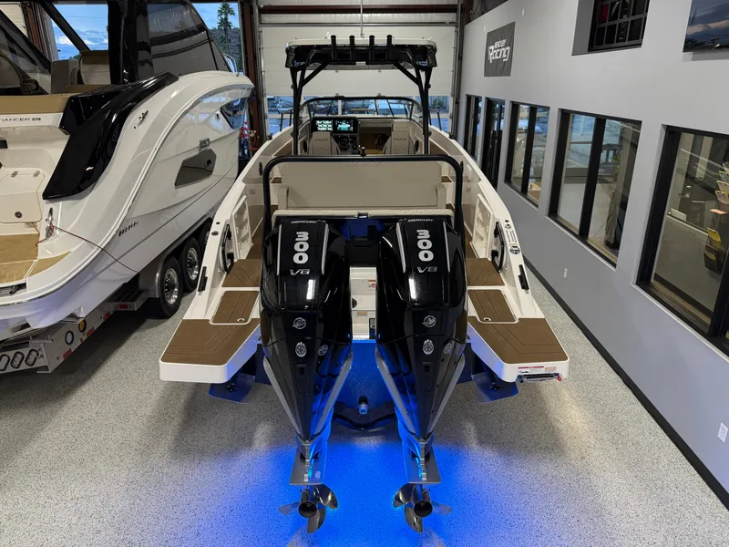 Slide: The Image of Navan S30 2025 boat with dual 300 V8 engines in showroom. - 33