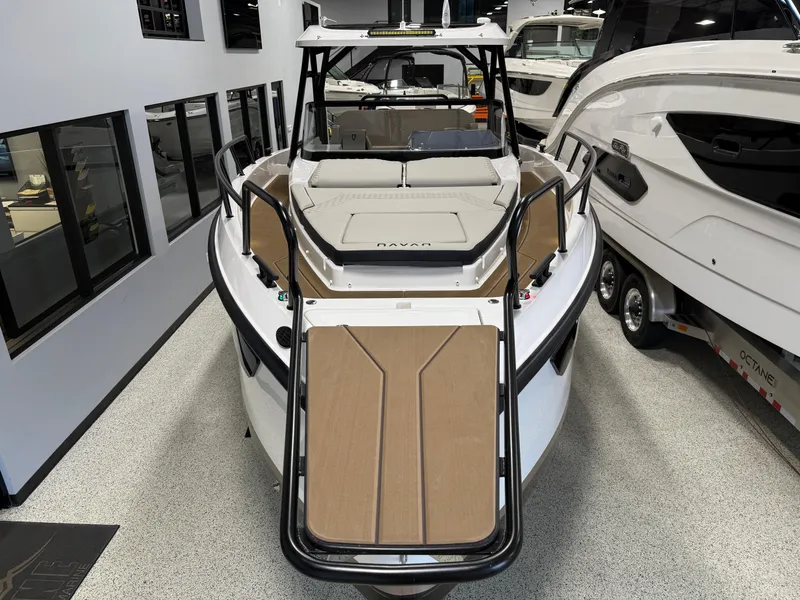Slide: The Image of 2025 Navan S30 boat in showroom, front view, sleek design, modern features. - 40