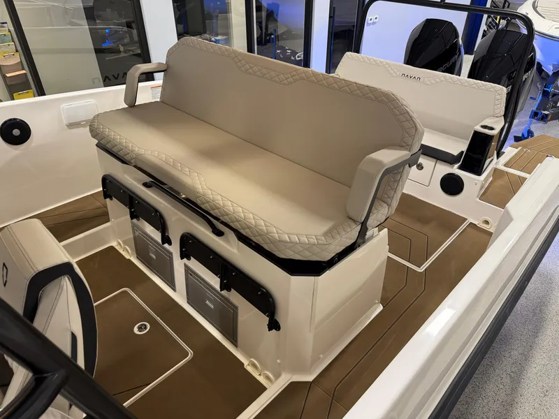 Slide: The Image of Navan S30 2025 boat interior with beige seating and storage compartments. - 49