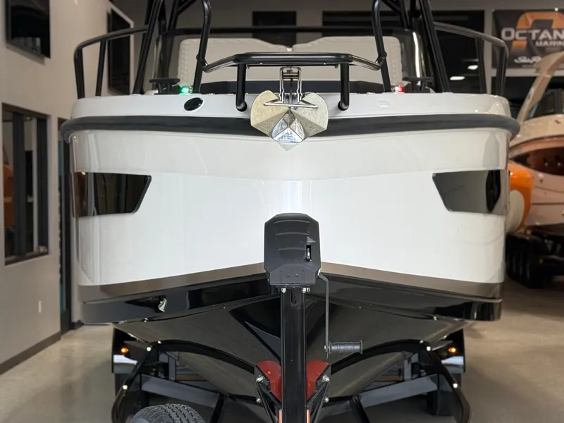 Slide: The Image of 2025 Navan S30 boat front view in showroom, showcasing sleek design and modern features. - 5