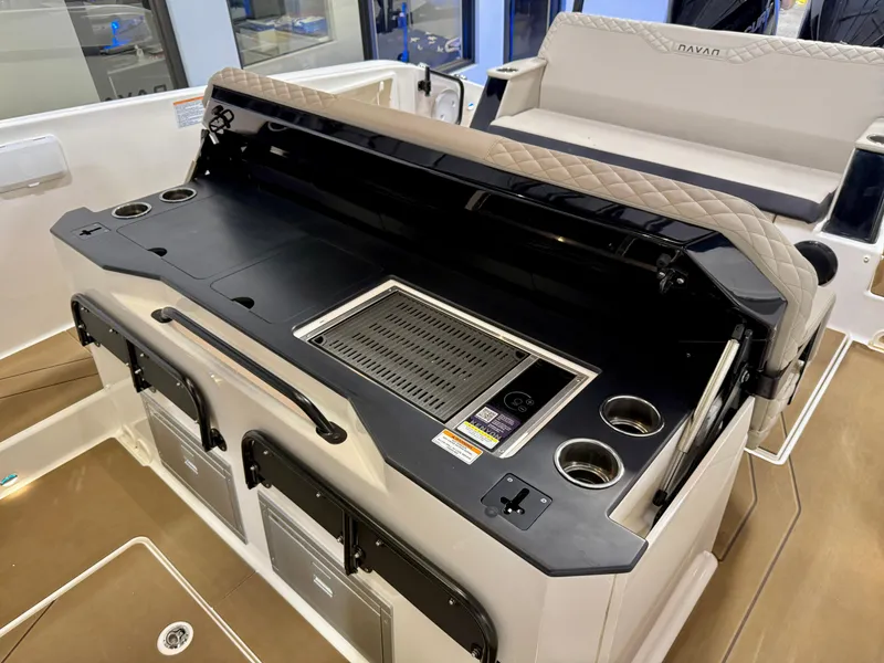 Slide: The Image of 2025 Navan S30 boat interior with grill and cup holders on deck. - 50