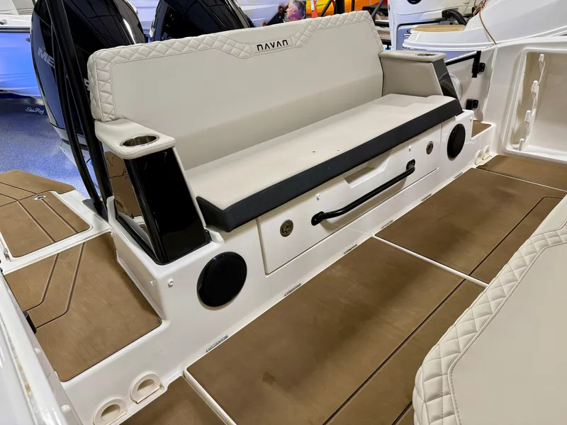 Slide: The Image of Navan S30 2025 boat interior with cushioned seating and storage compartment. - 55