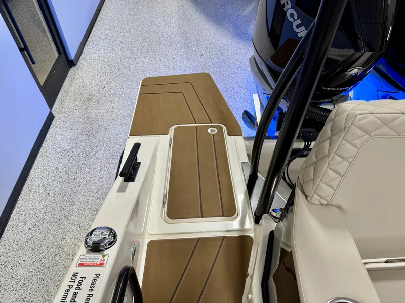 Slide: The Image of Navan S30 2025 boat interior with brown deck and cushioned seating. - 56