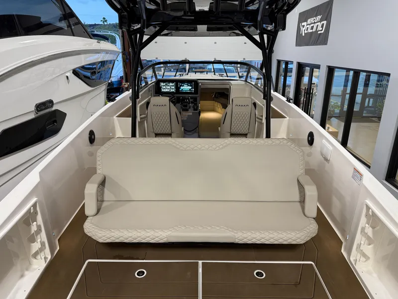Slide: The Image of 2025 Navan S30 boat interior with beige seating and modern dashboard. - 58