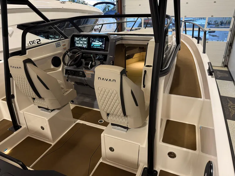 Slide: The Image of Interior view of 2025 Navan S30 boat with modern dashboard and seating. - 61