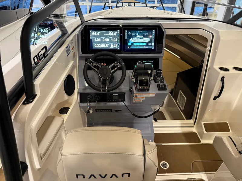 Slide: The Image of Interior view of 2025 Navan S30 boat cockpit with advanced navigation displays. - 64
