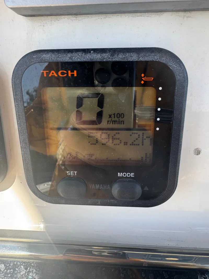 Slide: The Image of Yamaha tachometer display on 2013 Cobia 296 Center Console boat. - 11