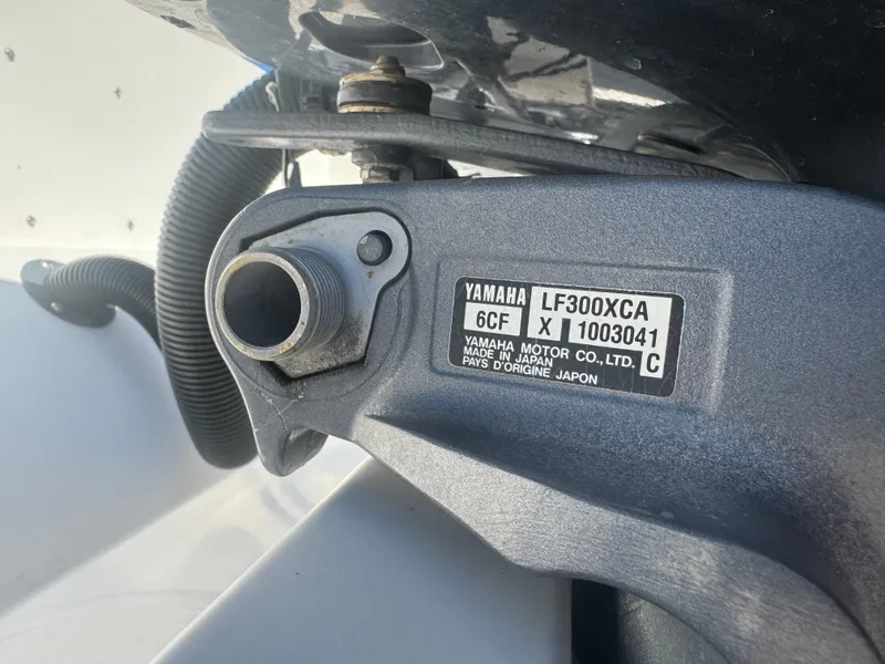 Slide: The Image of Close-up of Yamaha LF300XCA engine part on 2013 Cobia 296 Center Console boat. - 21