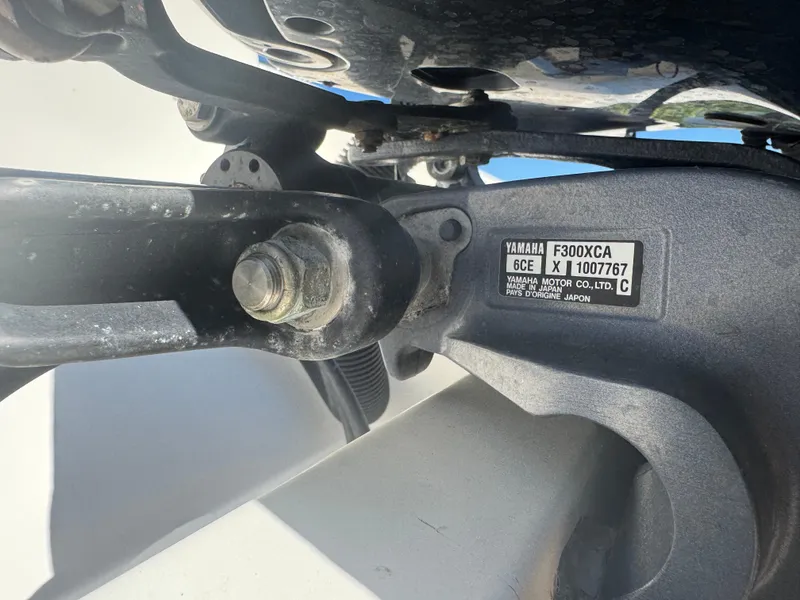 Slide: The Image of Close-up of Yamaha F300XCA engine part on 2013 Cobia 296 Center Console boat. - 22