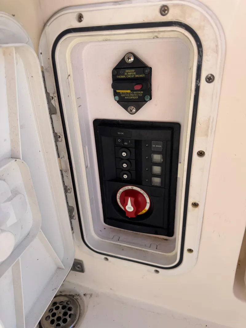 Slide: The Image of Control panel on a 2013 Cobia 296 Center Console boat. - 4