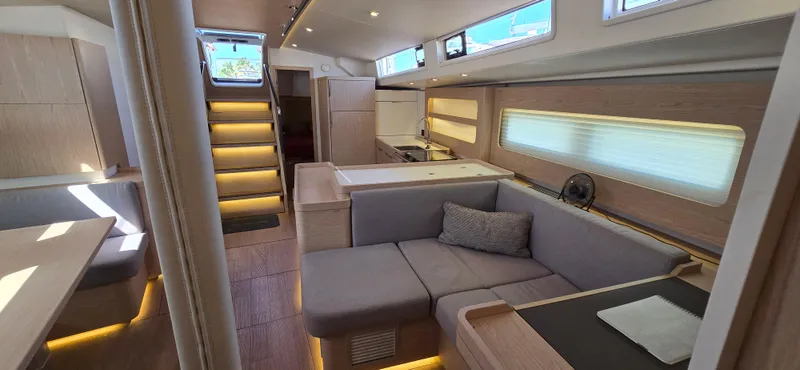 Slide: The Image of Luxurious interior of 2021 Beneteau Oceanis Yacht 54 with modern furnishings and ambient lighting. - 22