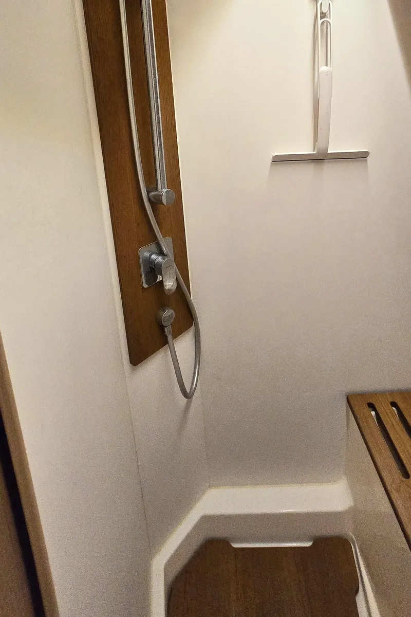 Slide: The Image of Shower area in 2021 Beneteau Oceanis Yacht 54, featuring modern fixtures and wooden accents. - 33